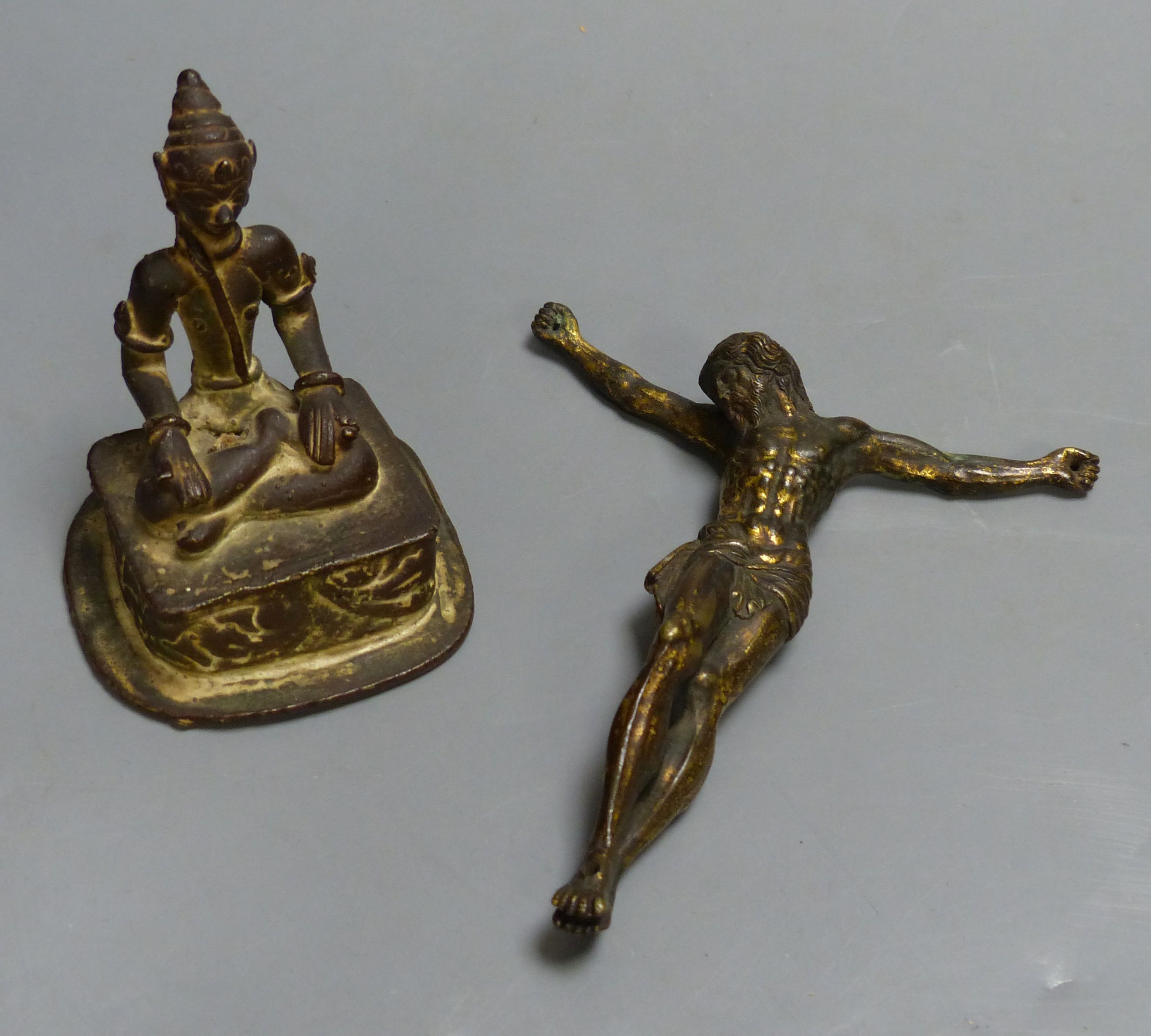 An Indian Buddhist figure and a gilt bronze Corpus Christi, largest 13cm